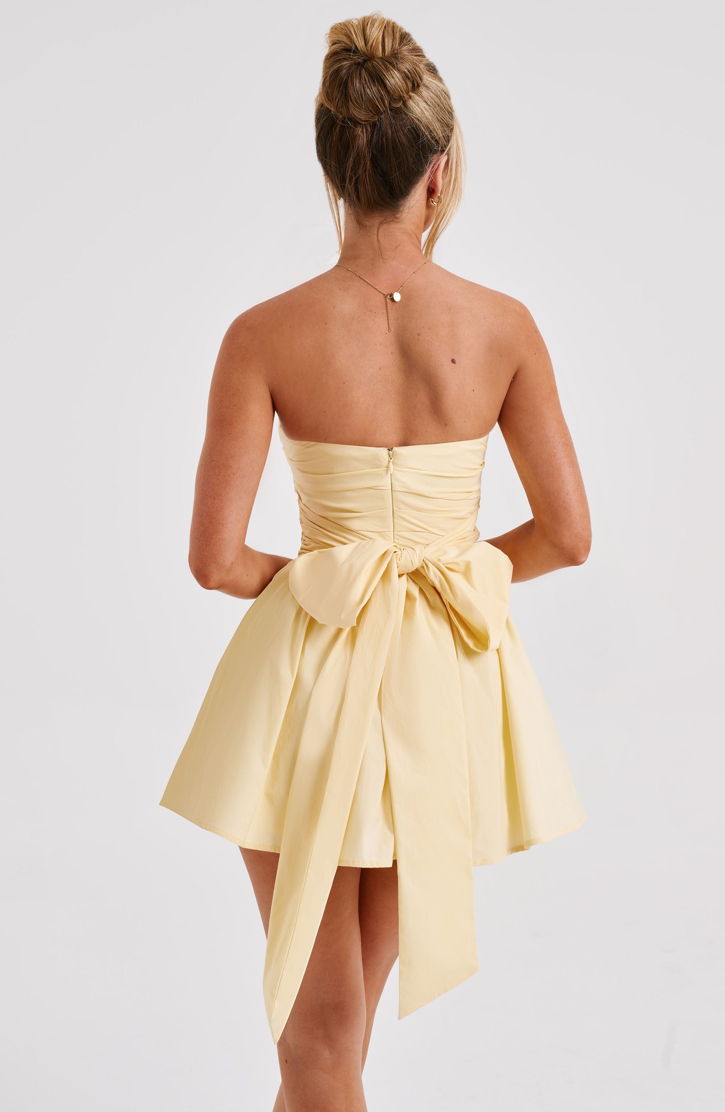 Katrina - Lemon strapless ruched mini dress with bow