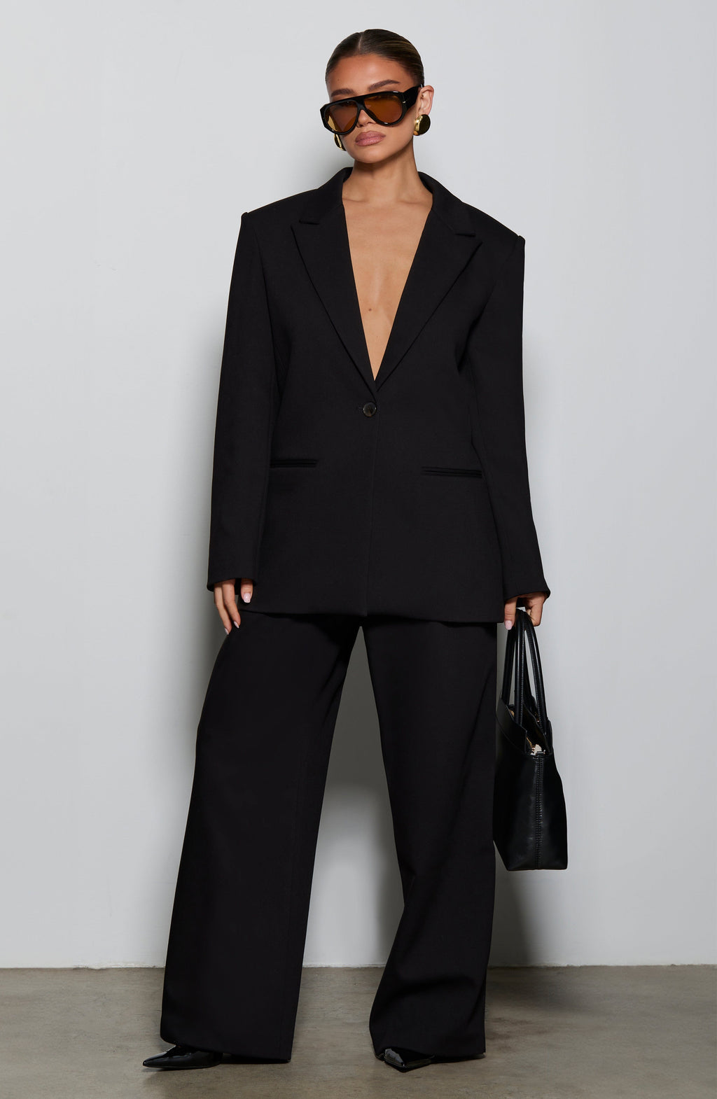 Kirsty - Black pleated low-rise wide-leg trousers